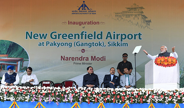 The Prime Minister, Shri Narendra Modi addressing the gathering at the inauguration of the Pakyong Airport, in Gangtok, Sikkim. The Union Minister for Commerce & Industry and Civil Aviation, Shri Suresh Prabhakar Prabhu, the Chief Minister of Sikkim, Shri Pawan Kumar Chamling, the Minister of State for Development of North Eastern Region (I/C), Prime Minister’s Office, Personnel, Public Grievances & Pensions, Atomic Energy and Space, Dr. Jitendra Singh and the Minister of State for Electronics & Information Technology, Shri S.S. Ahluwalia are also seen.