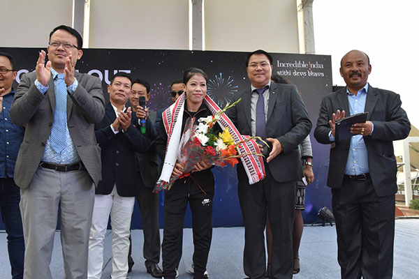 Mr. W. Ibohal Singh (MCS), Director (Tourism), Govt. of Manipur felicitating MC Mary Kom